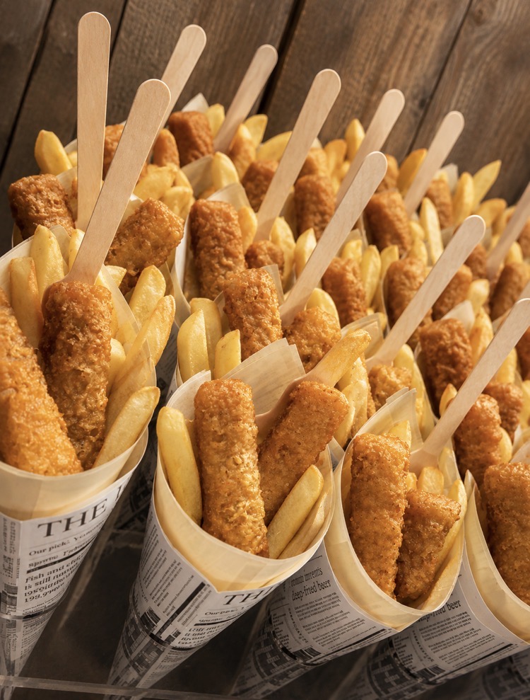Mini fish and chip cones in newspaper wraps with wooden forks