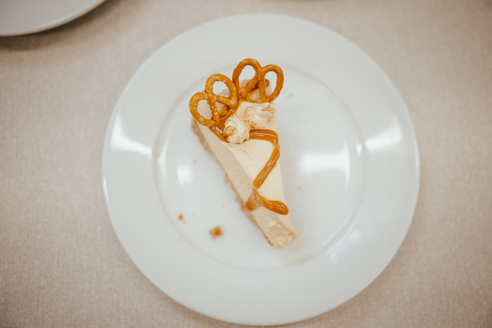 Salted caramel cheesecake with pretzel and popcorn from above