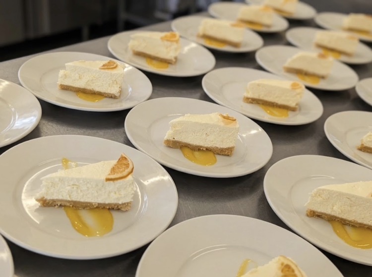 Lemon cheesecake desserts plated up for a barn wedding in west Norfolk