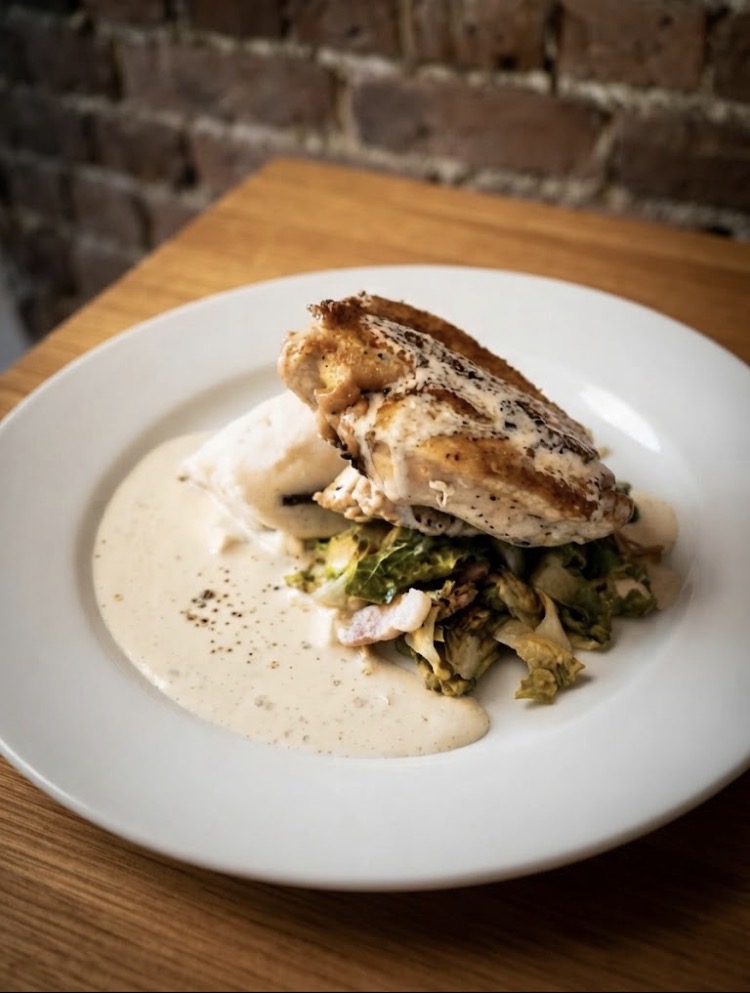Chicken supreme with mash, savoy cabbage and creamy peppercorn sauce
