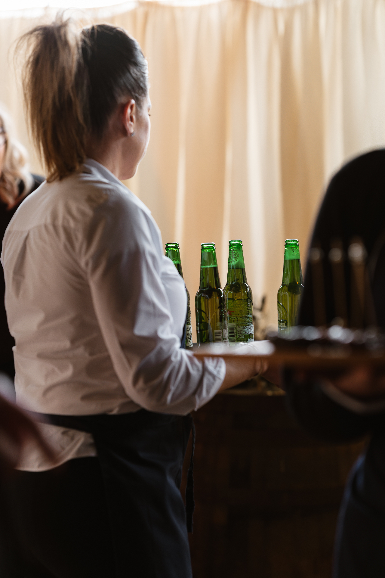 Guests with drinks at a Norfolk garden reception