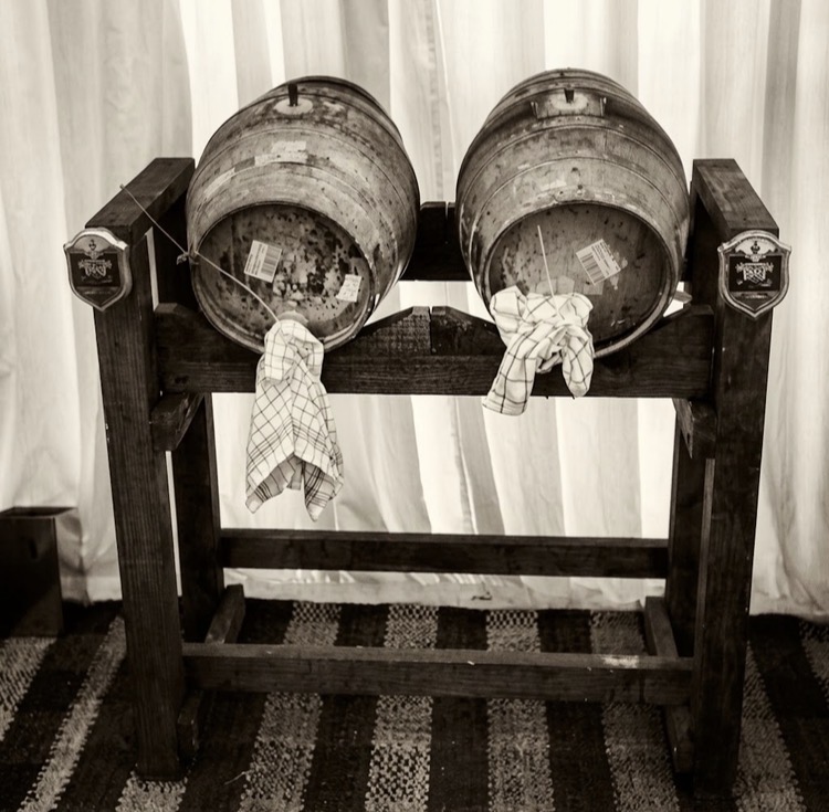 Real ale casks tapped and ready to serve at a wedding bar