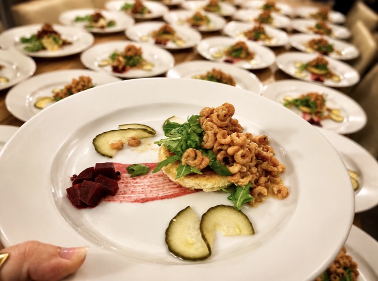 Plated starters being prepared for a private dinner party in Norfolk