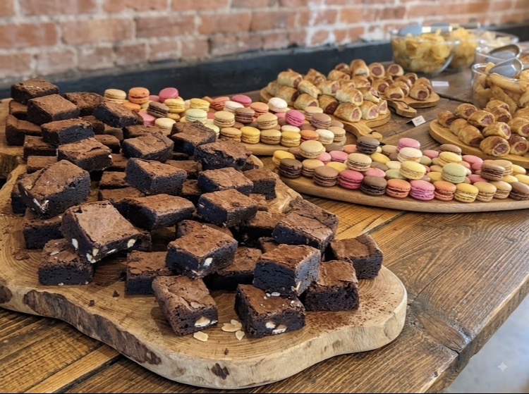 Dessert buffet table of brownies and macarons at a Norfolk wedding