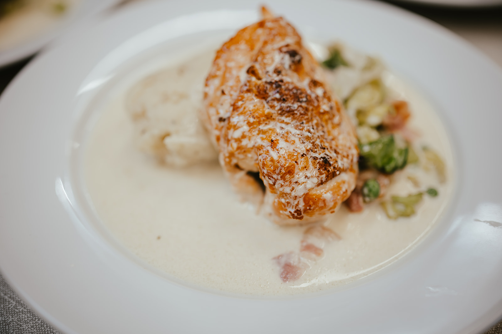 Roast chicken supreme with mashed potato, sprouts and bacon cream