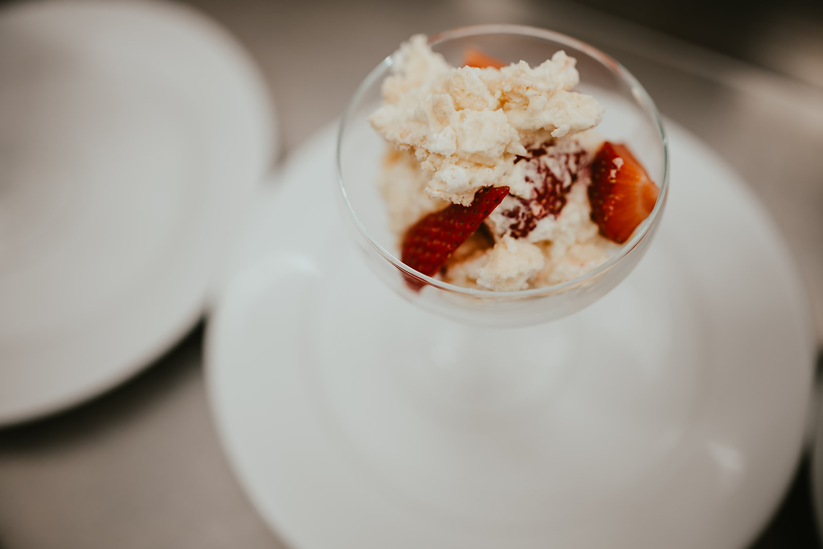 Strawberry and meringue dessert in a coupe glass